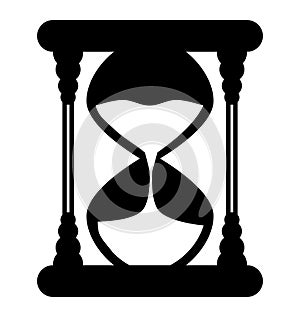 Stylized hourglass with flowing sand, black and white, isolated.