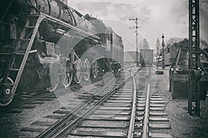 The stylized image of an old steam locomotive at the station