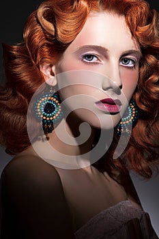 Stylized portrait of young beautiful red haired woman