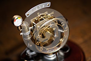 Stylized steampunk metal clock. Vintage concept mechanical clock.