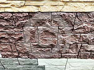 Stylized stone or brick plastic wall of different colors. Abstract Background, Texture, Pattern, frame, place for text