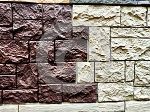 Stylized stone or brick plastic wall of different colors. Abstract Background, Texture, Pattern, frame, place for text