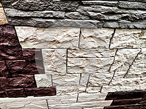 Stylized stone or brick plastic wall of different colors. Abstract Background, Texture, Pattern, frame, place for text