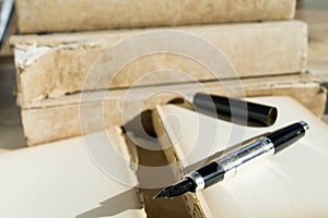 Stylographic pen and ancient manuscript