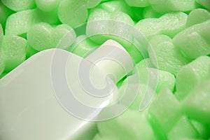 Styrofoam granular packaging filler for parcels, Protective Packaging . Glass perfume protection, sterilized glasses. Green