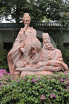 Statue of Su Dongpo and his wife at Huizhou West Lake photo