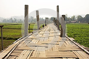 Su Tong Pae bamboo wooden bridge of Wat Phu Sa Ma temple for thai people and foreign traveler travel visit while PM 2.5 Dust