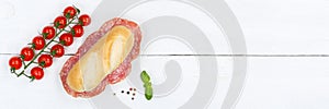 Sub sandwich with salami copyspace copy space banner from above on wooden board