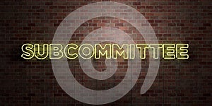 SUBCOMMITTEE - fluorescent Neon tube Sign on brickwork - Front view - 3D rendered royalty free stock picture