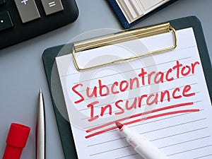 Subcontractor insurance written on a clipboard.