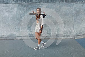 Subculture. Skater Girl With Skateboard At Skatepark Full-Length Portrait.