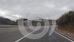 Subjective view of a vehicle tracing curves on a mountain road in the region of El Bierzo