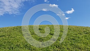 Sublime Grassy Hill and Blue Sky photo