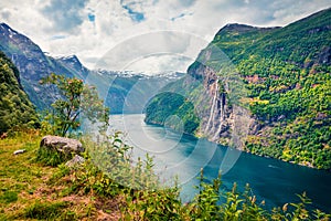 Sublime summer scene of Sunnylvsfjorden fjord, Geiranger village location, western Norway. Beautiful morning view of famous Seven