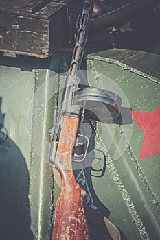 Submachine gun of Shpagin, PPSh been leaned against the armor of a tank as an illustration to the events of the Second World War