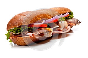 A submarine sandwich on a white background