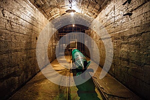 Submarine torpedo in old Soviet underground warship ammunition depot