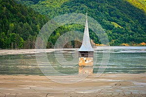 Submerged church in polluted lake at Geamana, Romania