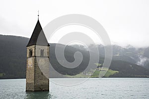 Submerged tower of reschensee church deep in Resias Lake