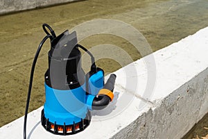 Submersible pump dewater construction site, pumping flood water sing deep well