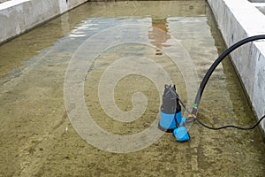 Submersible pump dewater construction site, pumping flood water sing deep well