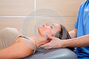 Suboccipital massage therapy to woman with doctor hands