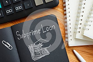 Subprime loan is shown on the business photo using the text photo