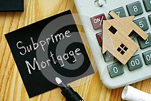 Subprime mortgage is shown on the business photo using the text photo