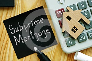 Subprime Mortgageis shown on the business photo using the text photo