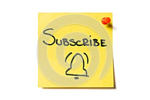 Subscribe and bell drawn on yellow sticky note. Online registration