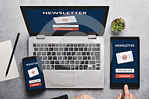 Subscribe newsletter concept on laptop, tablet and smartphone screen photo