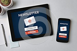 Subscribe newsletter concept on tablet and smartphone screen