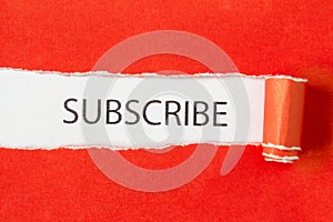 Subscribe Word on torn paper