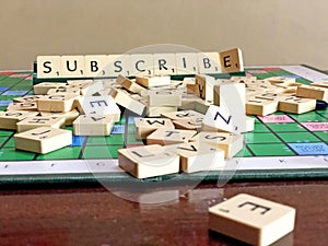 Subscribe word written on scrabble for content creation
