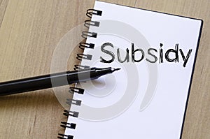 Subsidy write on notebook