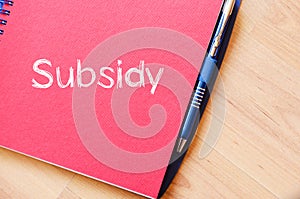 Subsidy write on notebook