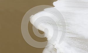 Layer of foam on ocean floor photo