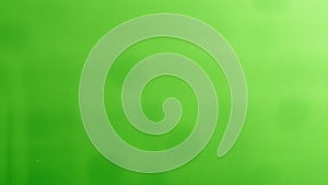 Subtle variations in a solid lime green background texture photo