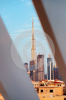 Suburb of Dubai with private residential buildings against the backdrop of a downtown metropolis with skyscrapers