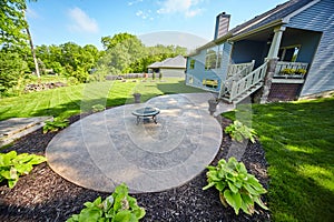 Suburban Backyard with Fire Pit and Lush Lawn, Eye-Level View