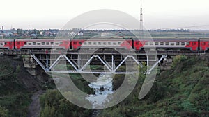 Suburban Electric Train Goes Over The Railway Bridge