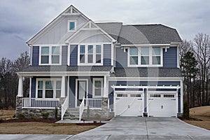 Suburban home exterior with a stone porch in a neighborhood in North Carolina