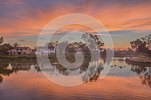 Suburban Lake and Reflection During Sunrise photo