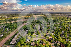 Suburban Neighborhood and Four Lane Road to Horizon in Spring