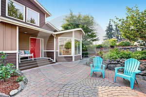 Suburban residential luxury house with paved brick patio.