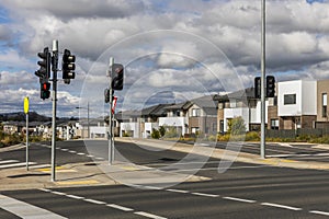 Suburban Street Intersection and Residential Area Under Heavy Clouds