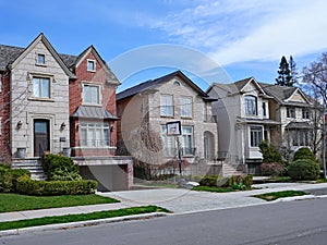 Suburban street with large detached houses