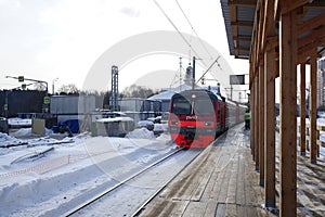 Suburban train ED4M at the temporary wooden platform in Balashikha railway station, Russia.