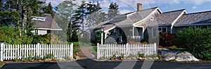 Suburban-type house with white picket fence