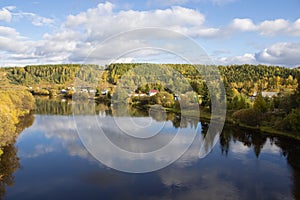 Suburbs, houses on banks of the river, a freight train and Lenins monument.